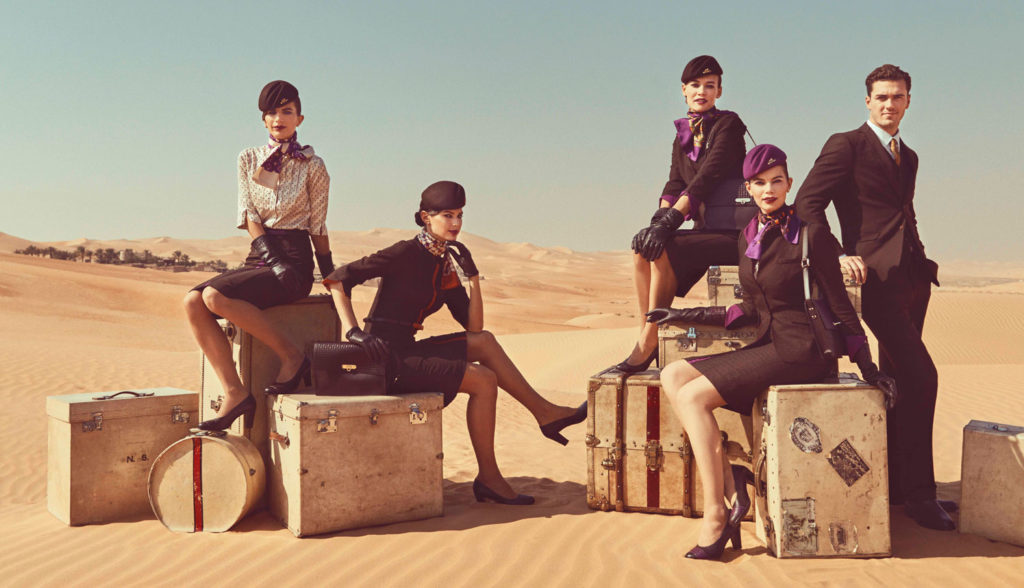 Etihad Airways Cabin Crew posing in the desert